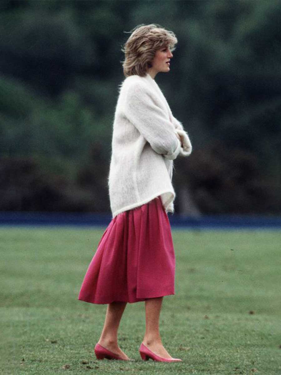 Fashion icon Princess Diana wearing a pink midi maxi dress with a white cozy sweater and pink heels