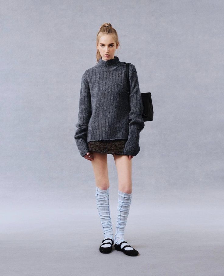 Grey sweater with mini skirt, tall blue socks, and ballet flats