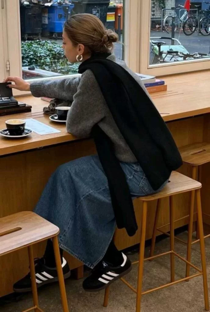 Grey sweater with mini skirt, tall blue socks, and ballet flats