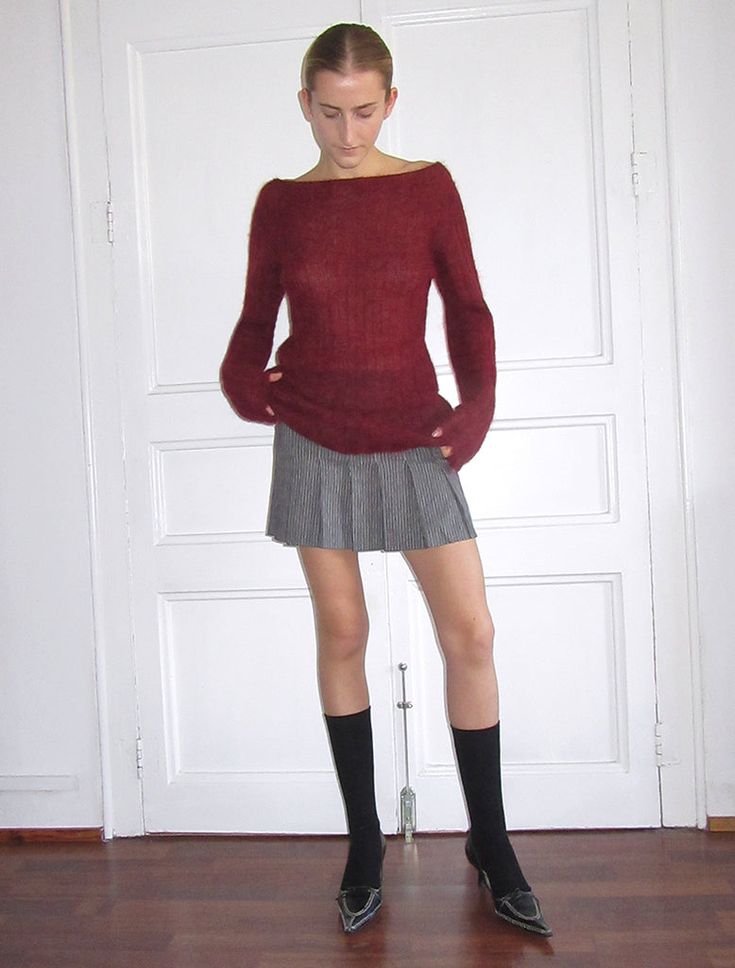 Grey sweater with mini skirt, tall blue socks, and ballet flats