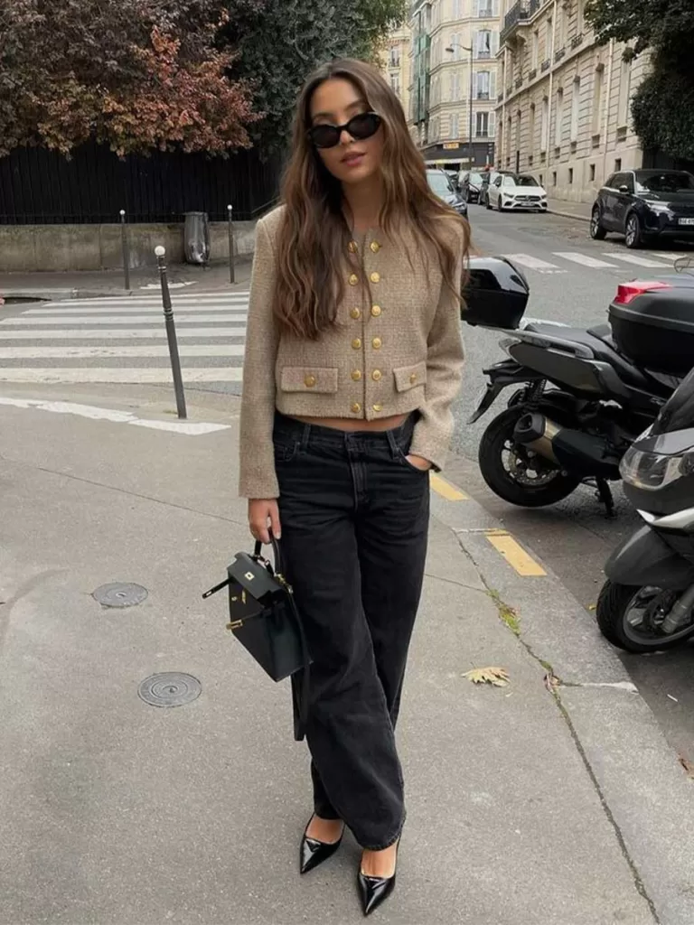 Girl wearing fall outfit featuring a classy gold button cardigan sweater, low rise black boyfriend jeans and black leather pointed toe kitten heels