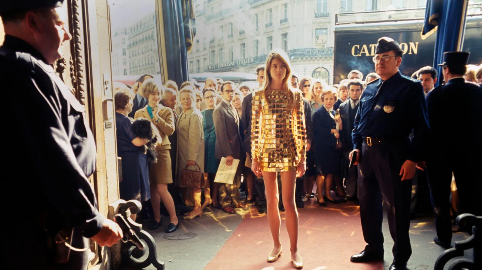 French singer Francoise Hardy in a french streetstyle shot wearing a Paco Rabanne gold plated mini dress